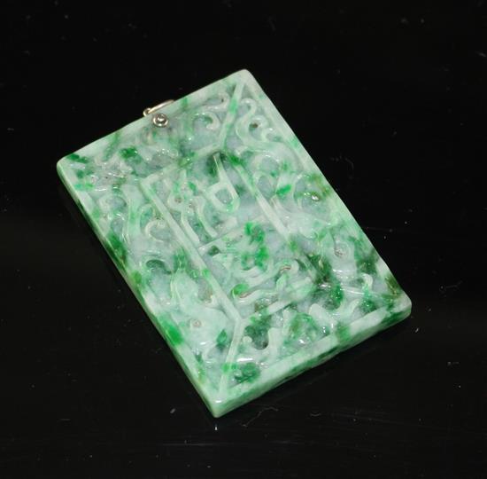 A carved jadeite and diamond set rectangular pendant, both sides decorated with Chinese characters and scrolls, 53mm,